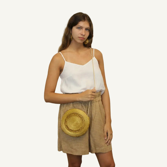 Detail of Dourado Circle Crossbody Bag showing handwoven Brazilian Golden Grass texture