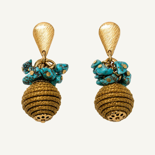 A pair of gold and turquoise drop earrings on a clean white background. Each earring features a textured gold teardrop-shaped top, a cluster of small turquoise stones with gold flecks, and a large ribbed gold bead drop below.