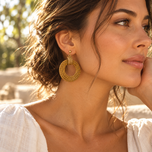 HELINN Sol Trancado Woven Circle Earrings worn with white linen