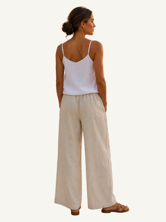 Back view of the Helinn Biscayne Linen Top in Ocean White showing adjustable shoulder straps and relaxed breathable linen silhouette.