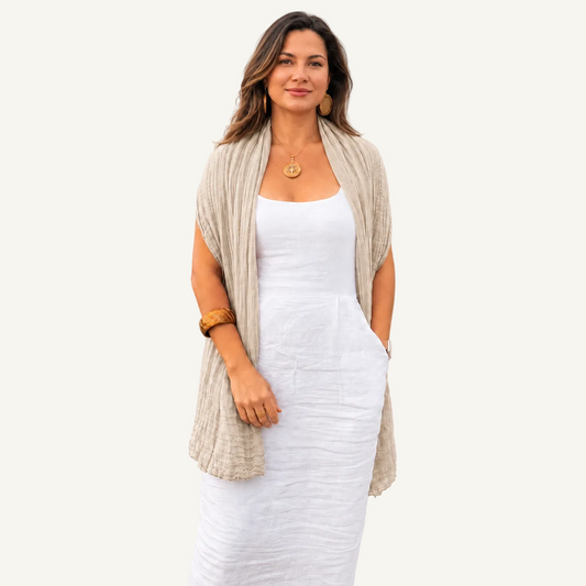 Vizcaya Linen Scarf in light beige draped over a white sleeveless dress