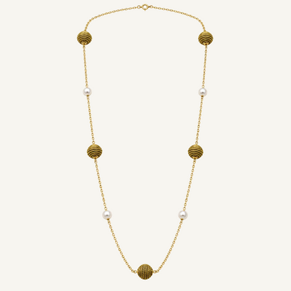 A gold chain necklace featuring five textured gold spherical beads and five small white pearls spaced along the chain, displayed on a clean white background.