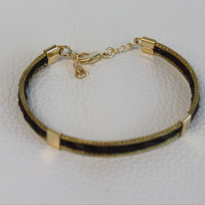 Close-up of the braided leather and polished 18K gold-plated detailing on the HELINN Aura Slim Leather Bracelet.