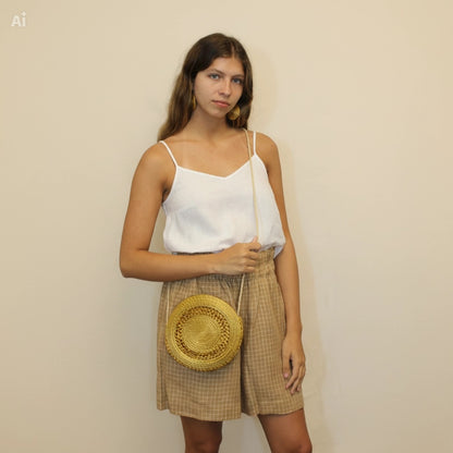 Detail of Dourado Circle Crossbody Bag showing handwoven Brazilian Golden Grass texture