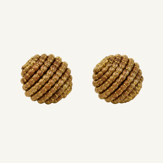 A pair of round, textured gold-toned earrings with a braided or woven appearance, shown on a clean white background.