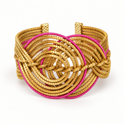 Vida Rosa Dourada Golden Grass Cuff Bracelet with pink detailing on a clean white background
