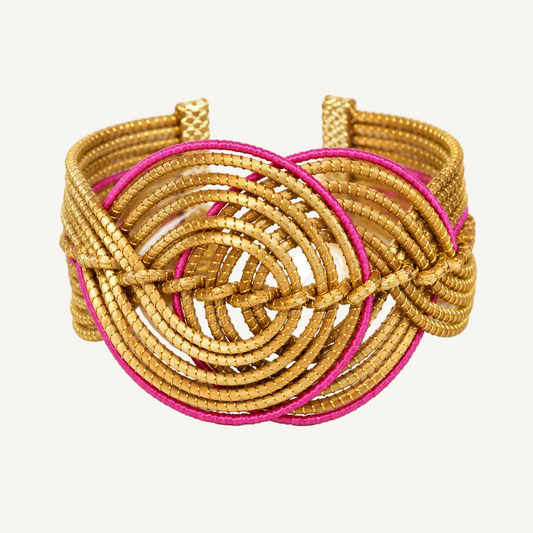 Vida Rosa Dourada Golden Grass Cuff Bracelet with pink detailing on a clean white background