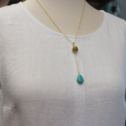 Aura Turquoise Drop Necklace handcrafted with Brazilian Golden Grass, natural turquoise teardrop, and premium 18K gold-plated chain by HELINN.