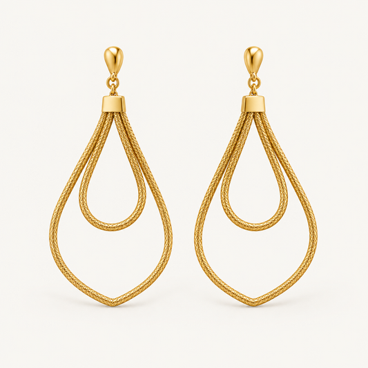 Brisa Dourada golden natural fiber earrings by HELINN on warm ivory background