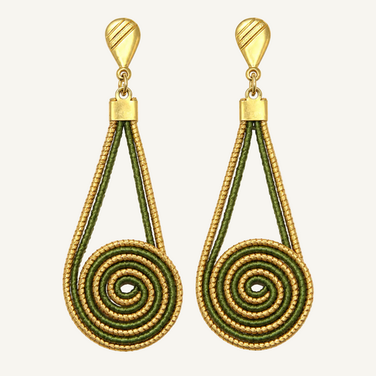 A pair of gold and olive green drop earrings with a textured spiral design, shown against a light off-white background.