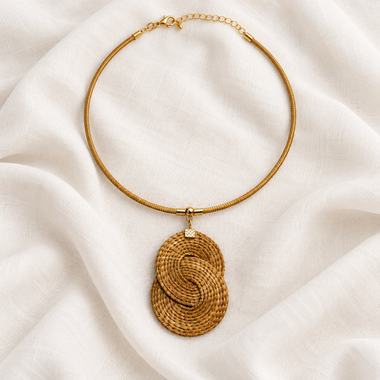Eclipse Golden Grass pendant necklace styled on ivory linen